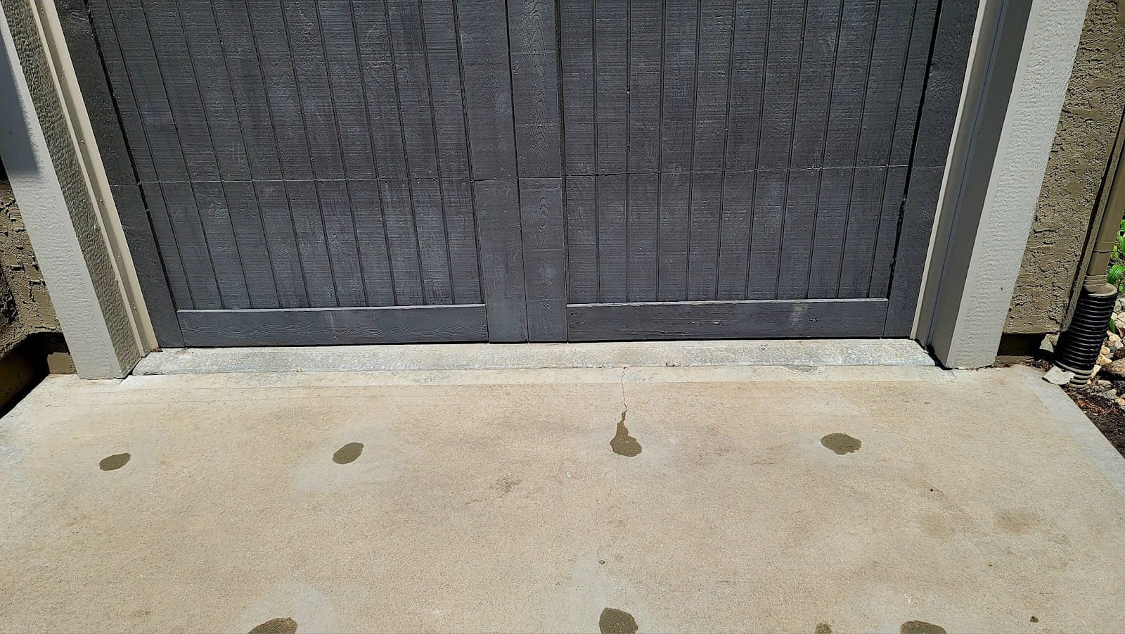 A leveled concrete slab with the injection holes patched flush and cleaned up